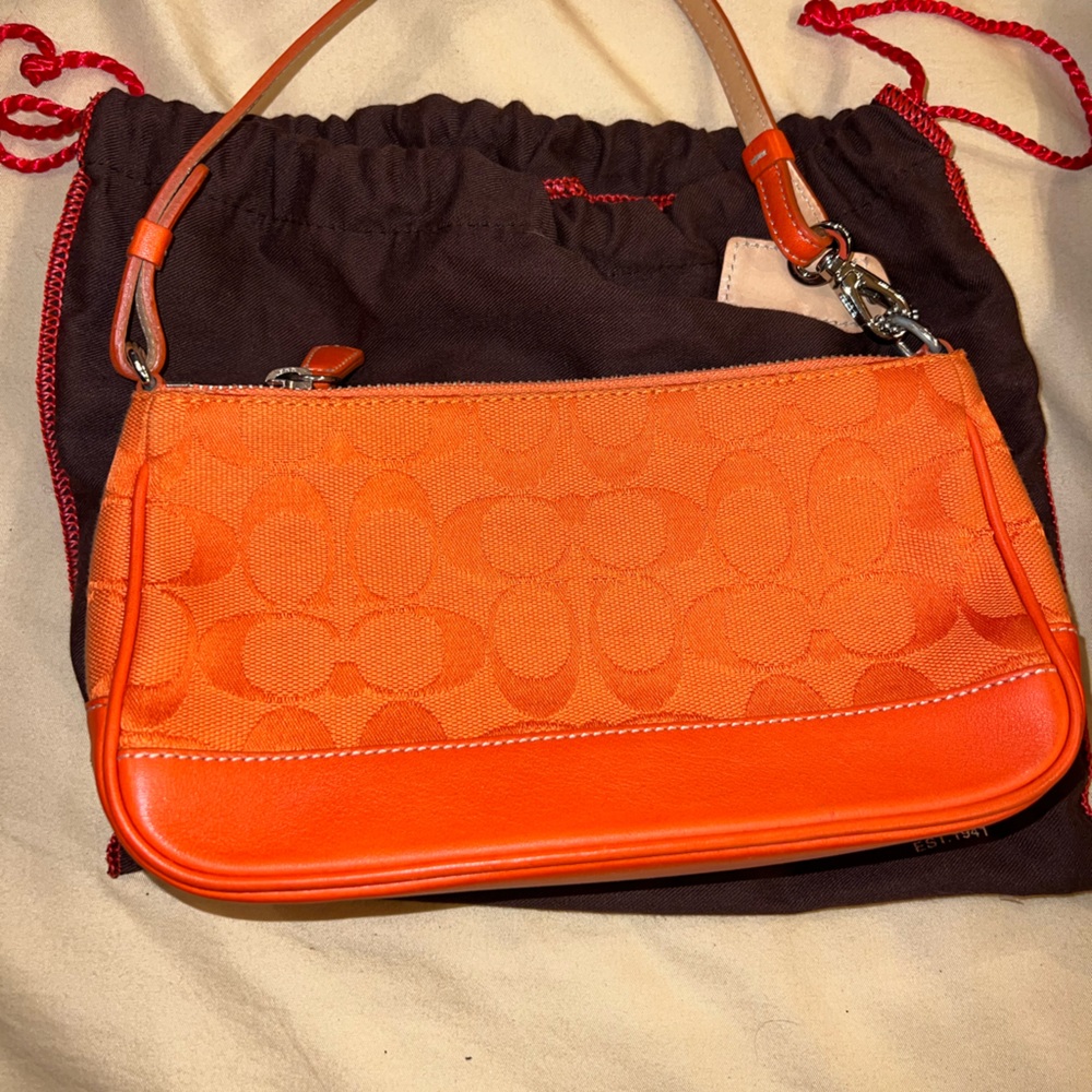Bright orange coach bag